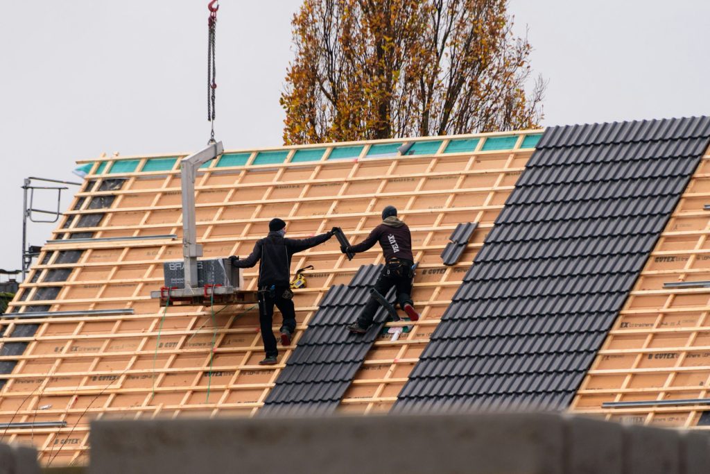 Crew installing a new tile roof